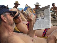 Beach side reading - Trinidad - Heather Miles