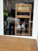 Feet in a cafe - Maureen Rogers